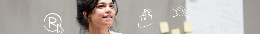 Woman thinks and looks at post-it' on wall with BOIP symbols next to it